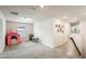 Upstairs playroom filled with toys and furniture adjacent to staircase at 10815 Windswept Garden Way, Tampa, FL 33647