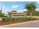 Stone monument sign for the community Amenity Center surrounded by landscaping and mulch at 10815 Windswept Garden Way, Tampa, FL 33647