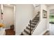 Carpeted stairway with decorative railing leading to upper level at 10815 Windswept Garden Way, Tampa, FL 33647