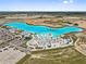 Stunning aerial view of community lagoon with white sand beach, lounging areas and clear blue water at 10937 Penny Gale Loop, San Antonio, FL 33576
