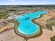Scenic aerial view of a large, resort-style lagoon surrounded by new home construction at 10937 Penny Gale Loop, San Antonio, FL 33576