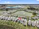 Aerial view of the property in a community near a lake, highlighting its prime location and neighborhood at 10937 Penny Gale Loop, San Antonio, FL 33576