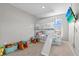 Bright bedroom featuring a unique bunk bed with a slide and playful decor at 10937 Penny Gale Loop, San Antonio, FL 33576