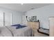 This bedroom features neutral paint, carpet and furnishings, including a dog bed at 10937 Penny Gale Loop, San Antonio, FL 33576