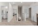 Hallway with neutral carpeted floors shows access to the bathroom and bedroom at 10937 Penny Gale Loop, San Antonio, FL 33576