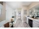 Bright bathroom featuring a glass shower, a soaking tub and a modern vanity at 12164 Cattleside Dr, Riverview, FL 33579
