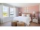 Bright bedroom featuring a cozy bed, and large windows that provide plenty of natural light at 12164 Cattleside Dr, Riverview, FL 33579