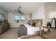 Comfortable bedroom with a view, featuring stylish decor and ample natural light for a relaxing space at 12168 Cattleside Dr, Riverview, FL 33579