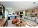 Open loft area with versatile living space including a seating area, desks, and decorative accents at 12168 Cattleside Dr, Riverview, FL 33579