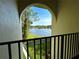 Charming view from the balcony overlooking a scenic lake and fountain at 1423 Pine Glen Ln # D2, Tarpon Springs, FL 34688