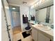 Bright bathroom featuring updated sink and vanity at 1423 Pine Glen Ln # D2, Tarpon Springs, FL 34688