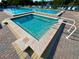Community pool featuring a spa with accessibility railings at 1423 Pine Glen Ln # D2, Tarpon Springs, FL 34688