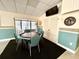 Game room features a poker table and TV at 1423 Pine Glen Ln # D2, Tarpon Springs, FL 34688