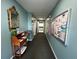 Hallway with decor, mirror, water fountain, and bulletin board at 1423 Pine Glen Ln # D2, Tarpon Springs, FL 34688