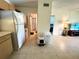 Living space with tile floors leading to the bedrooms, kitchen, and living room at 1423 Pine Glen Ln # D2, Tarpon Springs, FL 34688