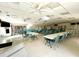 Well-lit meeting room with ample seating and storage options at 1423 Pine Glen Ln # D2, Tarpon Springs, FL 34688