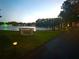 Water view with bench, fountain, lighting, and walkway in this welcoming community at 1423 Pine Glen Ln # D2, Tarpon Springs, FL 34688