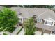 Aerial view of townhomes with well-maintained roofs and surrounding mature trees at 2009 River Turia Cir, Riverview, FL 33578