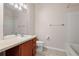 Neutral bathroom featuring a vanity with a sink, toilet, and shower-tub combination at 2009 River Turia Cir, Riverview, FL 33578