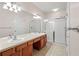 Primary bathroom featuring double sinks, shower, and separate toilet at 2009 River Turia Cir, Riverview, FL 33578