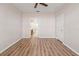 A bedroom with wood floors has a partial view of an en-suite bathroom at 2009 River Turia Cir, Riverview, FL 33578