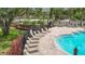 View of community pool with lounge chairs, landscaping and community walkway at 2009 River Turia Cir, Riverview, FL 33578