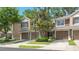 Charming townhomes featuring attached garages and lush landscaping, providing a welcoming curb appeal at 2009 River Turia Cir, Riverview, FL 33578