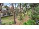 Exterior view of a two-story condominium building surrounded by trees and lush greenery at 2009 River Turia Cir, Riverview, FL 33578