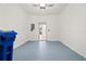 Spacious, clean garage with painted floors and an open view towards the house at 2009 River Turia Cir, Riverview, FL 33578