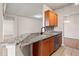 Kitchen bar area with modern stainless steel appliances and granite countertops, bright and open at 2009 River Turia Cir, Riverview, FL 33578
