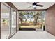 Enclosed patio with beautiful backyard views and access to side yard at 2009 River Turia Cir, Riverview, FL 33578