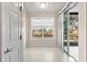 Bright sun room with tile flooring, windows, and sliding doors to outdoor area at 2009 River Turia Cir, Riverview, FL 33578