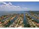 An aerial view showcasing the waterfront home's prime location within a network of canals and proximity to the open bay at 2063 Illinois Ne Ave, St Petersburg, FL 33703