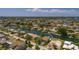 Waterfront home featuring lush landscaping, boat dock, and sparkling swimming pool, nestled in a canal community at 2063 Illinois Ne Ave, St Petersburg, FL 33703