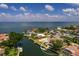 Waterfront home with boat dock, a swimming pool, and lush foliage, offering direct access to the bay at 2063 Illinois Ne Ave, St Petersburg, FL 33703