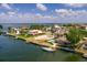 Aerial of waterfront homes with a sailboat docked and the Gulf of Mexico in the background at 2063 Illinois Ne Ave, St Petersburg, FL 33703