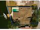 Aerial view of waterfront property with private dock, boat and a pool with a blue outline of the property at 2063 Illinois Ne Ave, St Petersburg, FL 33703