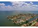 An aerial showing the waterfront location, and nearby houses within the canal neighborhood and ocean at 2063 Illinois Ne Ave, St Petersburg, FL 33703