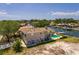 Exterior back view of house on canal with boat and pool. Beautiful home in a waterfront neighborhood at 2063 Illinois Ne Ave, St Petersburg, FL 33703
