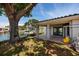 Backyard showing a covered patio and a waterfront with a boat at 2063 Illinois Ne Ave, St Petersburg, FL 33703