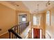 Foyer featuring hardwood floors and a dazzling chandelier that complements the design at 2063 Illinois Ne Ave, St Petersburg, FL 33703