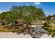 Charming home featuring mature trees, a front lawn, and a driveway at 2063 Illinois Ne Ave, St Petersburg, FL 33703