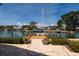 Patio view overlooking the waterway featuring a boat dock and sailboat at 2063 Illinois Ne Ave, St Petersburg, FL 33703