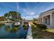 Waterfront home view showing the canal, a sailboat, and a private boat dock at 2063 Illinois Ne Ave, St Petersburg, FL 33703