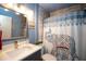 Well-lit bathroom with modern vanity, elegant tile work and a stylish elephant-themed shower curtain at 2132 40Th N Ave, St Petersburg, FL 33714
