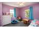 Bright bedroom featuring playful decor and plenty of natural light from two windows at 2132 40Th N Ave, St Petersburg, FL 33714