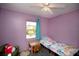 Cozy bedroom with light purple walls and comfortable furniture, creating a relaxing atmosphere at 2132 40Th N Ave, St Petersburg, FL 33714