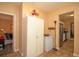 Hallway leading to the kitchen, with extra storage and a view of the bedroom at 2132 40Th N Ave, St Petersburg, FL 33714