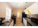 Well-lit kitchen with white cabinets, tile floors, and black appliances at 2132 40Th N Ave, St Petersburg, FL 33714