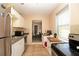 Galley kitchen featuring stainless steel appliances and tile backsplash at 2132 40Th N Ave, St Petersburg, FL 33714